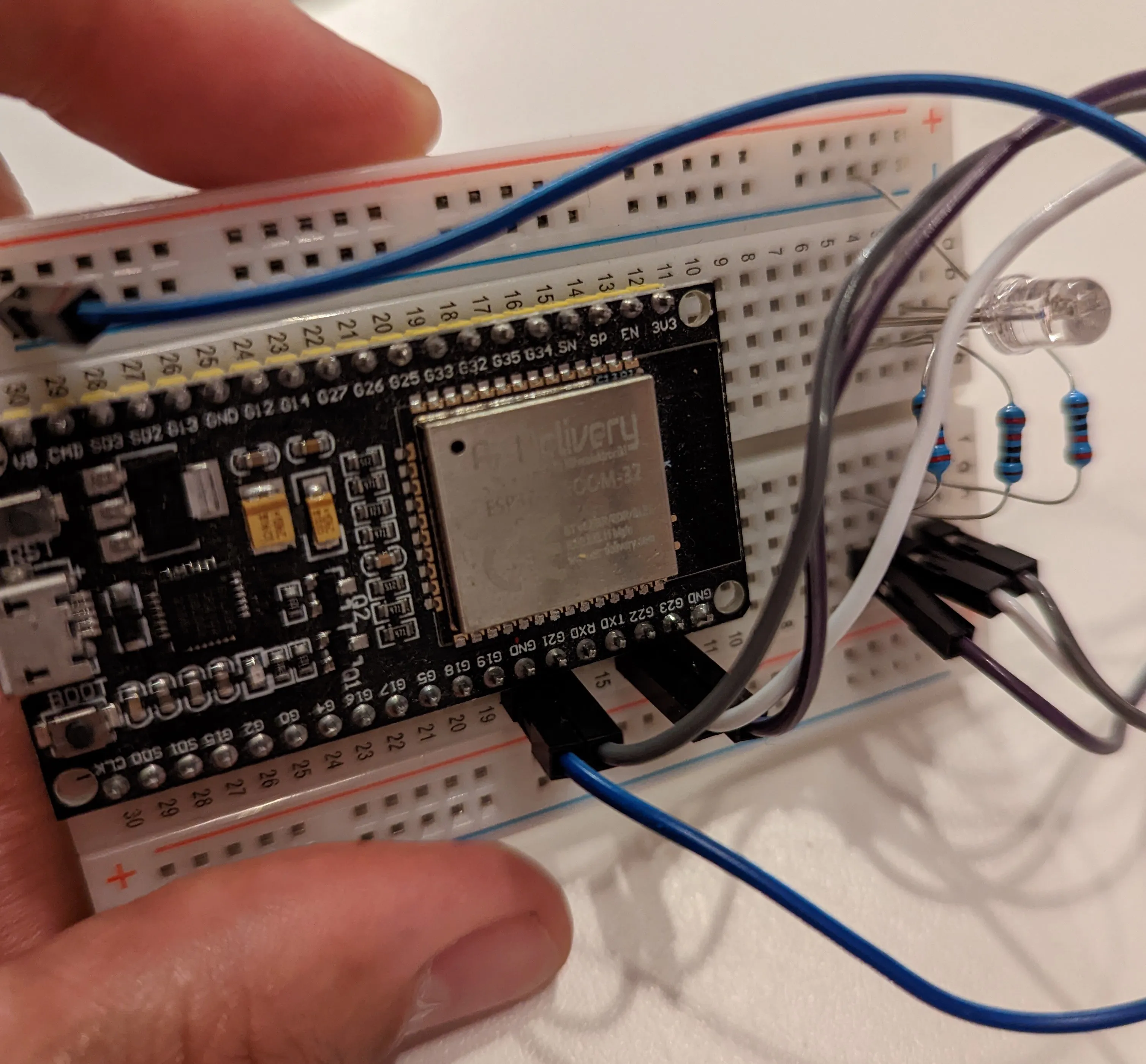 An ESP32 on a breadboard with an RGB LED