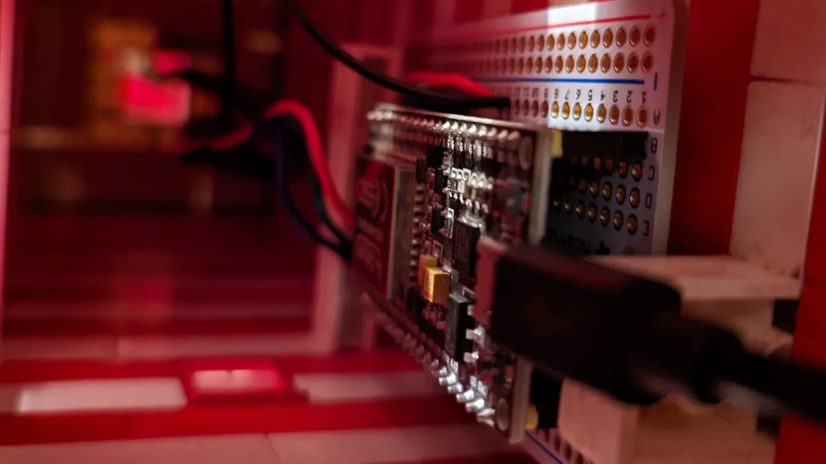 a view inside a lego tower with an electronics board and an RGB LED